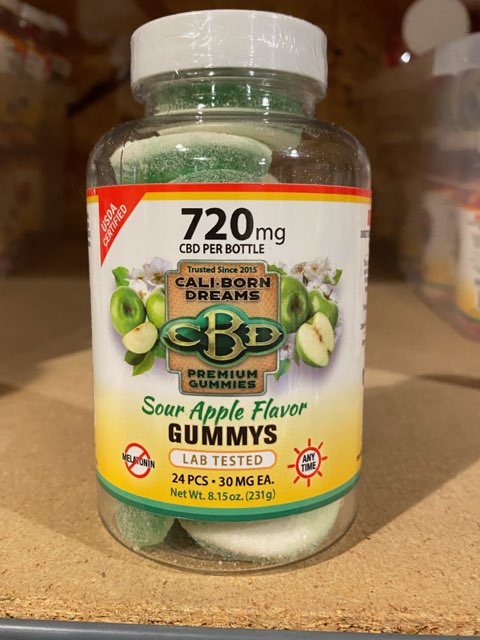 an image of a clear can of CBD sour apple gummy's from Cali Born Dreams.
