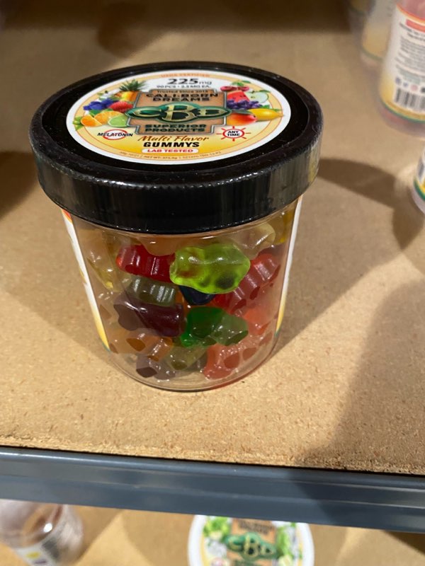 an image of a clear can of CBD Gummy's from Cali Born Dreams.