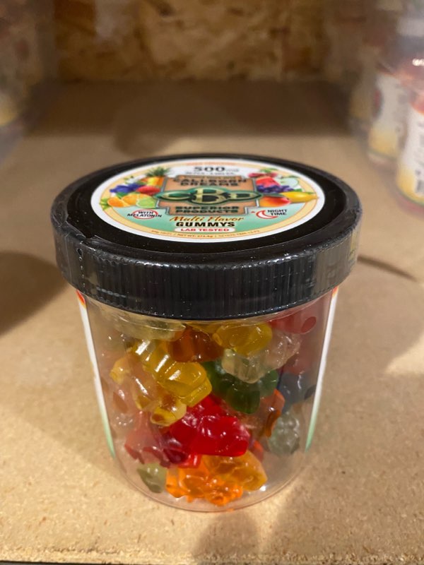 an image of a clear can of multi flavor CBD Gummy's from Cali Born Dreams.