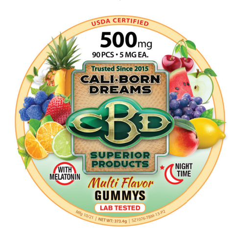 An image of CBD multi flavored gummies from Cali Born Dreams is shown. The gummies are brightly colored. The product packaging indicates that each gummy contains 5mg of CBD and that the total package contains 500mg of CBD. The gummies are arranged in a neat, orderly manner, making them look both delicious and high-quality.